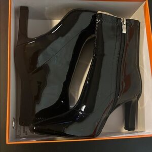 Sleek Black Patent Leather Heeled Boots
